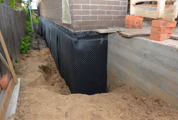 Happy homeowners after waterproofing job in West Liberty